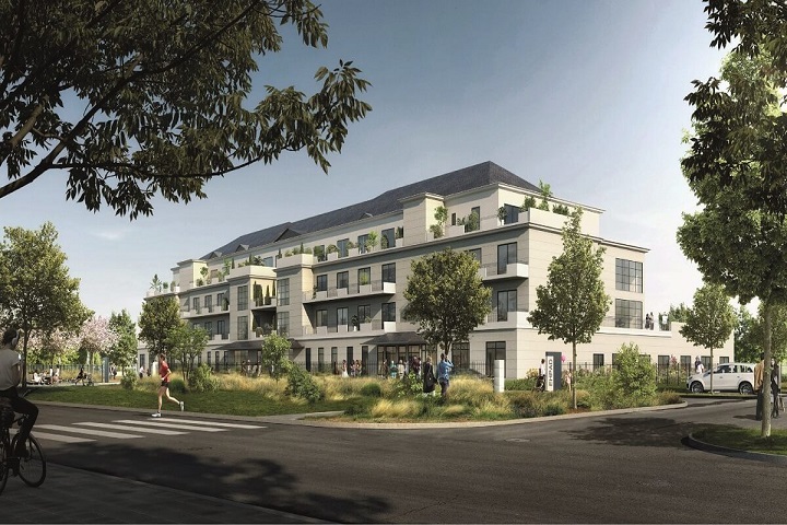 Résidence contemporaine avec balcons et espaces verts, intégrée dans un environnement urbain paysager.