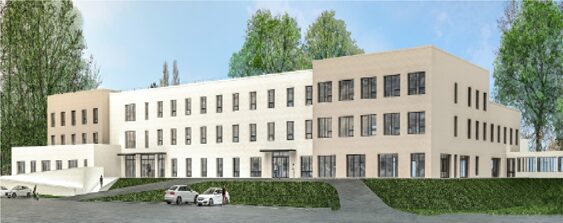 Bâtiment institutionnel contemporain à façade claire, intégré dans un environnement urbain végétalisé.Clinique SSR construction