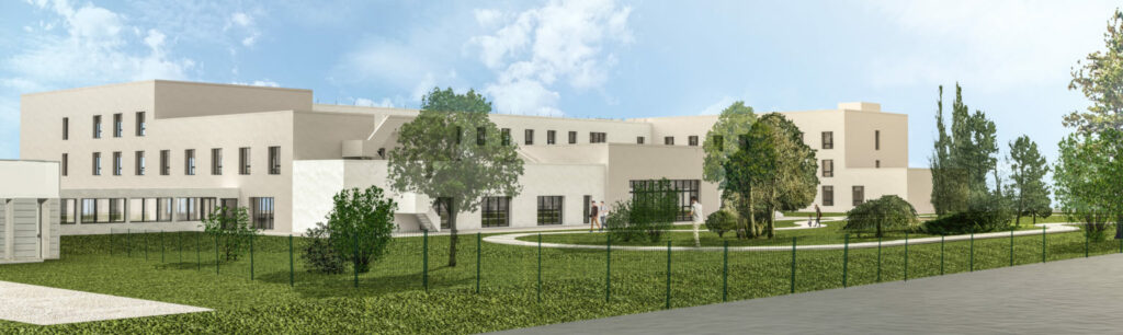 Clinique SSR construction,Bâtiment de santé contemporain à façade claire, intégré dans un environnement paysager verdoyant.