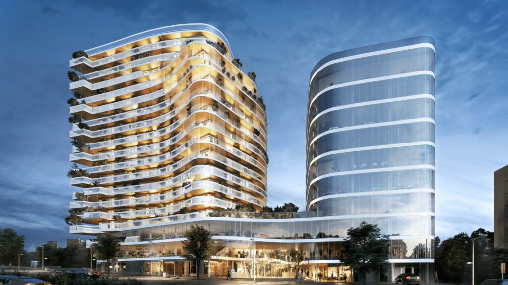 Immeuble résidentiel contemporain aux lignes courbes, entouré d’un environnement végétalisé.EMBLEM